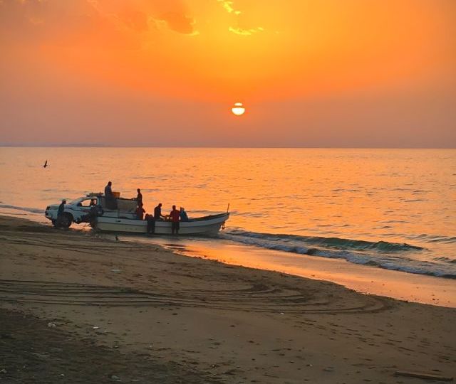 beautiful-sunset-with-fisherman-boat-muscat-beach (1)