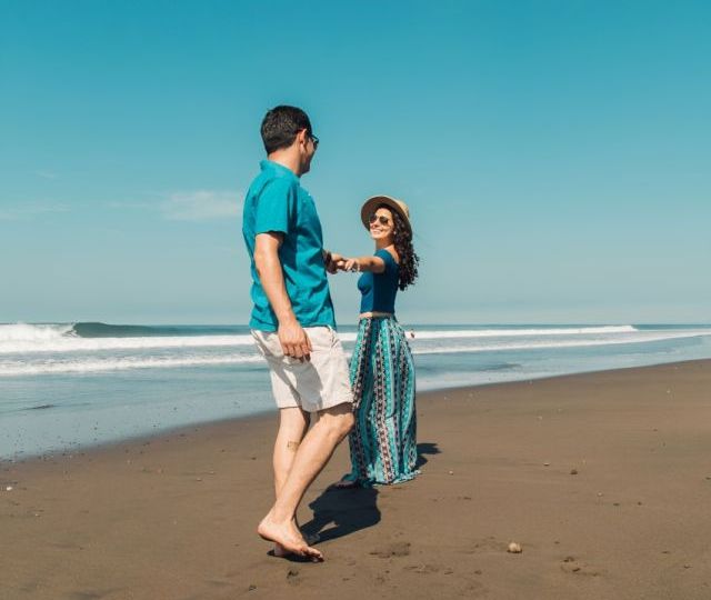 Couple having fun at beach in Morjim