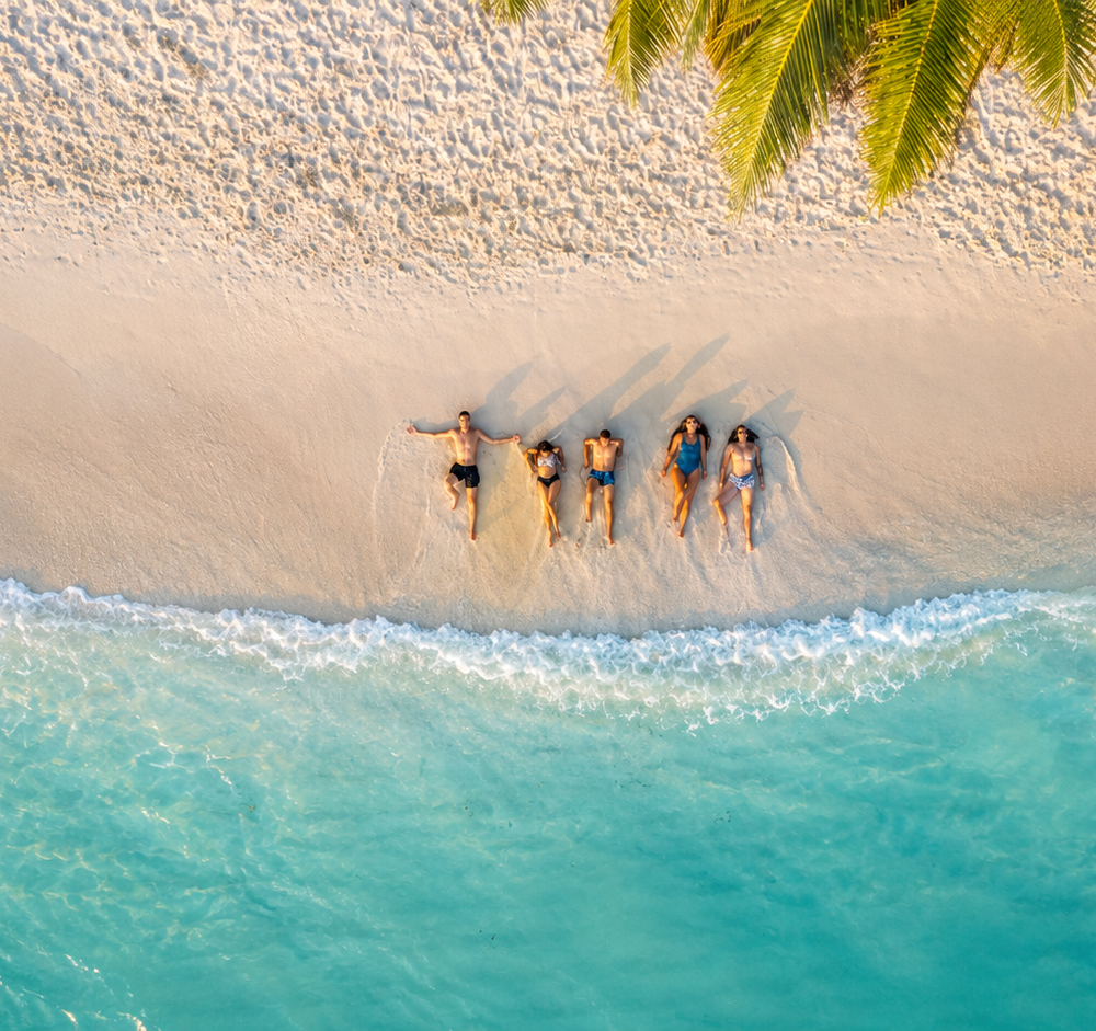 Bunch of friends on beach top shot